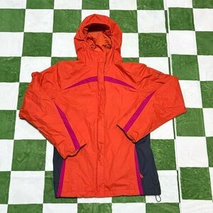 Women’s medium Colombia orange heavy raincoat with purple and black trim